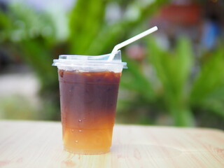 Iced coffee mixed with orange juice, two tones layer decoration.