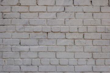 Grey brick wall. Weathered texture stained old paint grey brick wall. Colored brick wall background