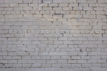 Grey brick wall. Weathered texture stained old paint grey brick wall. Colored brick wall background