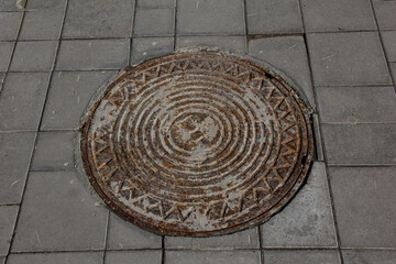 Old cast iron manhole cover