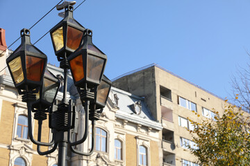 Fototapeta na wymiar Lamp post in Lviv city in autumn day