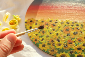 Female hand holds brush, close up and selective focus