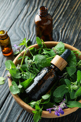 Concept of aromatherapy with mint on wooden background