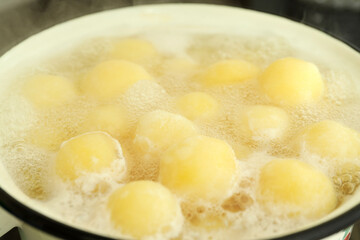 Concept of cooking with boiled young potatoes