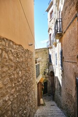 A narrow street between the old houses of Guardia Sanframondi, a village in the province of Benevento, Italy.	
