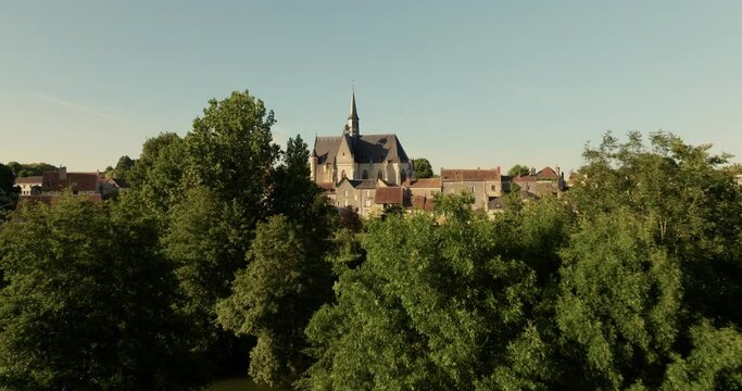 Aerial view of the church of Montr&eacute;sor during sunset in France.