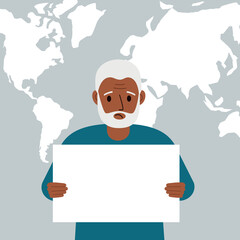 A sad man holds and shows a white blank sheet, or a poster. Against the backdrop of the karate of the world.