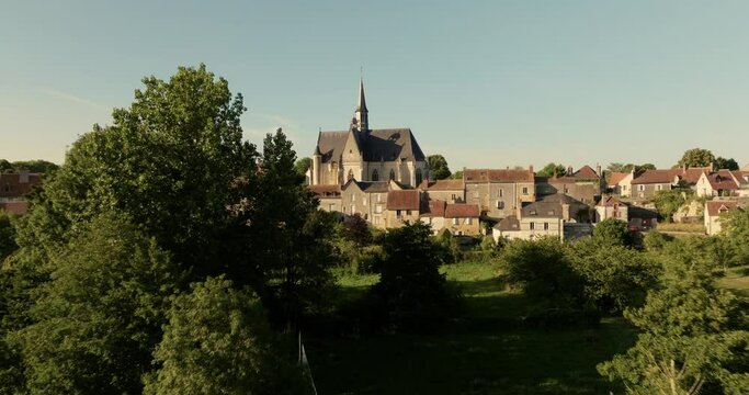 Aerial view of the church of Montr&eacute;sor during sunset in France.