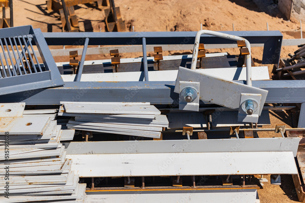 Poster building materials at a construction site. prepared materials and embedded parts for foundations at 