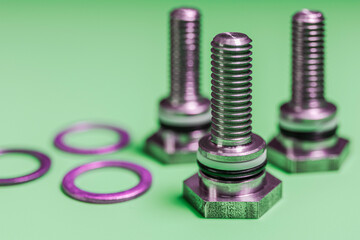 Metal bolts with copper nuts. Close-up. Macro shooting. Copy space.