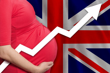 British pregnant woman on flag of United Kingdom background. Birth rate up