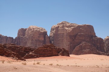 Fototapeta premium Amazing Martian scenery of Wadi Rum desert with rocks and red dunes in Jordan.
