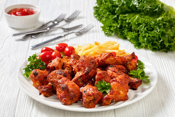 roast chicken wings with french fries and veggies