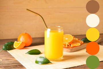 Glass of fresh tangerine juice on wooden background. Different color samples