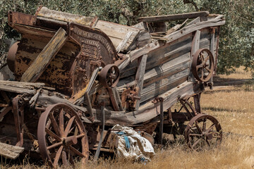 Fototapeta na wymiar Italian wrecked combine harvester of late XIX century 