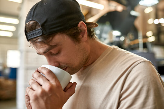 Barista snif fresh aromatic natural coffee in cup