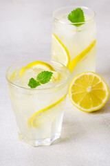Glasses of Fresh Infused Water with Lemon and Mint Detox Healthy Drink Vertical