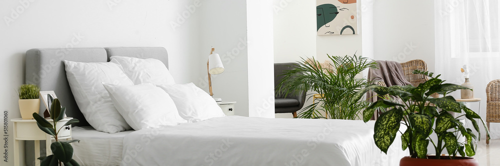 Sticker big comfortable bed with clean linen in room