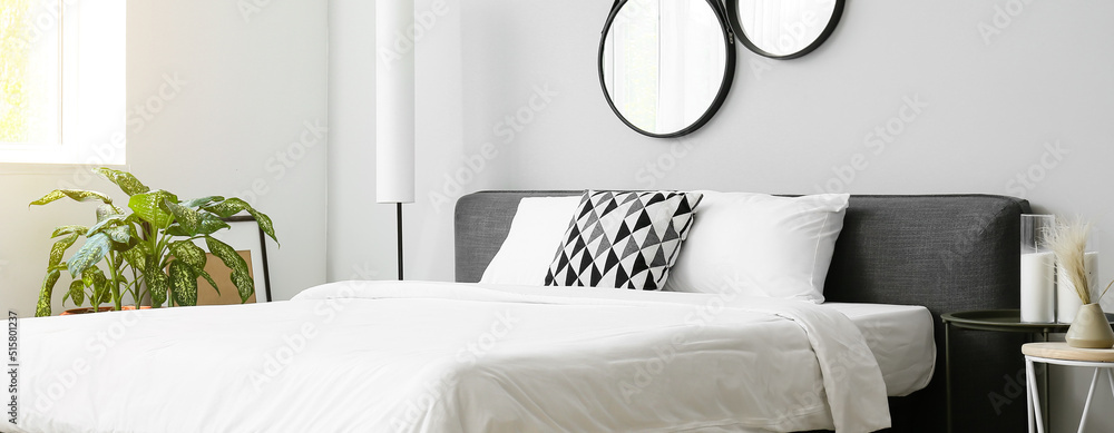 Wall mural Big comfortable bed with clean linen in room