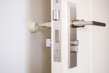 Wall mounted door stopper with modern door handle