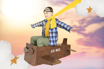 dreams of traveling. the boy is flying on a wooden plane