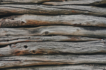 Simple wooden wall of a simple mountain shed from Valdres Folk Museum, Oppland, Norway.