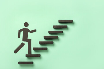 Ladder with running man on color background. Concept of progress