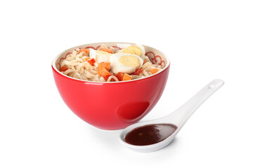 Bowl of tasty noodles with eggs and sauce isolated on white background