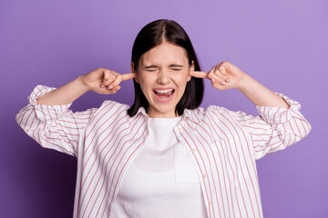 Photo of young girl cover ears fingers scream loud noise stressed fail isolated over violet color background