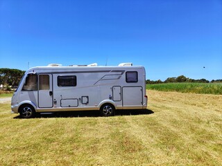 large camper parked on the grass