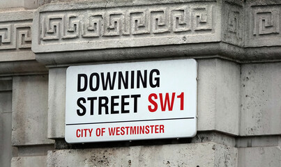 Downing Street sign on a wall in London, UK. 