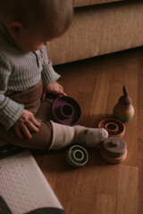 Little baby playing toys at home