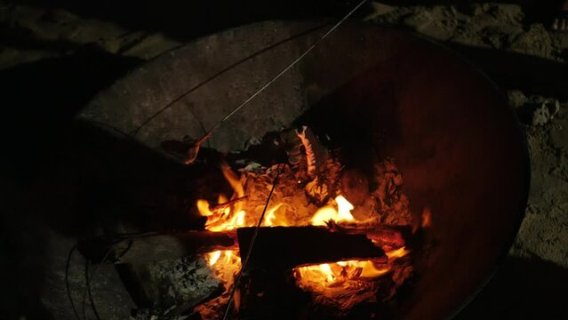 roating mashmallow candy on the firewood heat while camping.