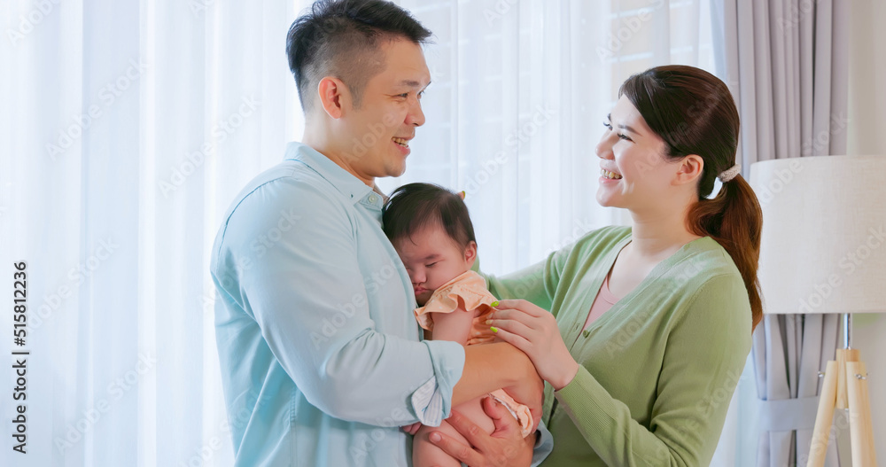 Wall mural Young parent hug with child