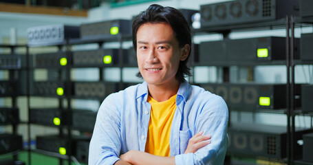 asian man smiling at camera