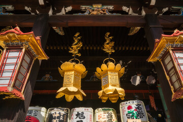 Beautiful architectural details and traditional Japanese iconography at Kitano Tenmangu Shrine at the Poets Festival in Kyoto, Japan.