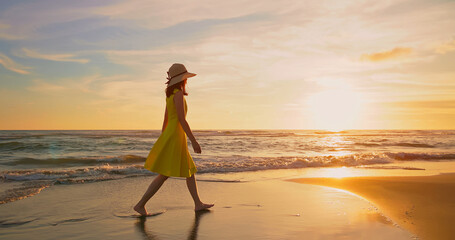 woman walking by beach