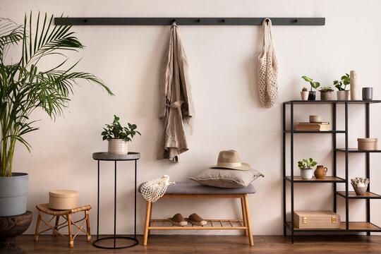 The Stylish Composition Of Cosy Entryway With Grey Bench, Black Consola, Hanger And Lamp. Beige Wall. Home Decor. Template.