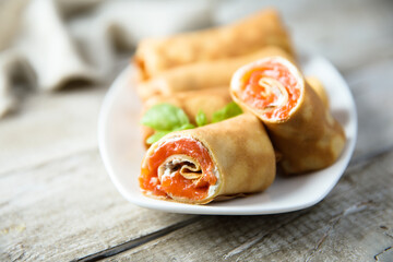 Homemade crepes with salmon and cream cheese