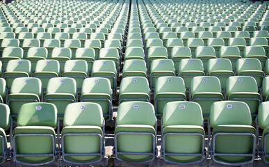Naklejka premium Empty Plastic Chairs at the Stadium
