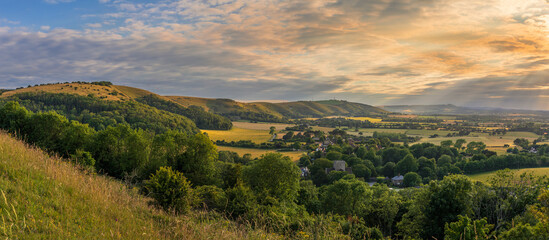 Beautiful views west over the village of Poynings from Devils Dyke to Chanctonbury ring on the south downs in west Sussex south east England UK