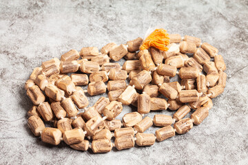 Rosary or prayer beads on a marble background.