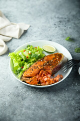 Roasted salmon steak with green salad