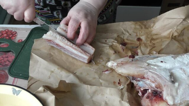 the cook cuts into pieces sea fish cod
