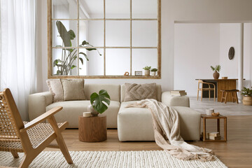 Modern interior of open space with modular sofa, furniture, wooden coffee tables, plants and...