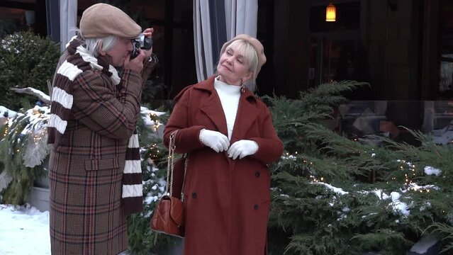 Slow Motion Beautiful senior couple on a walk in city center and making photo
