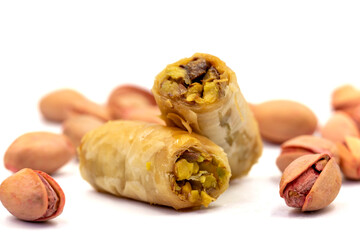 Pistachio baklava. Baklava isolated on white background. Traditional Turkish cuisine delicacies. Baklava filled with pistachio. close up