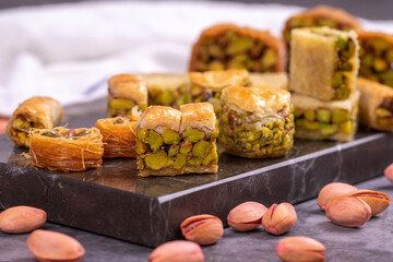 Varieties of pistachio baklava. Varieties of baklava on a dark background. Traditional Turkish...