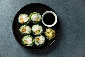 Healthy green sushi rolls with shrimps
