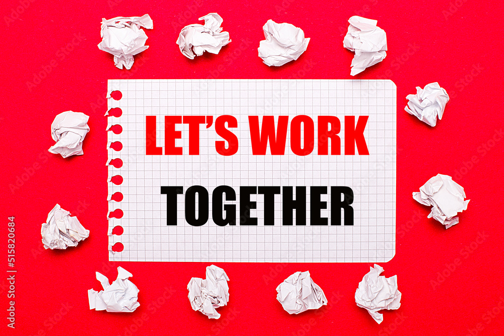 Poster on a bright red background, white crumpled sheets of paper and a sheet of paper with the text let is
